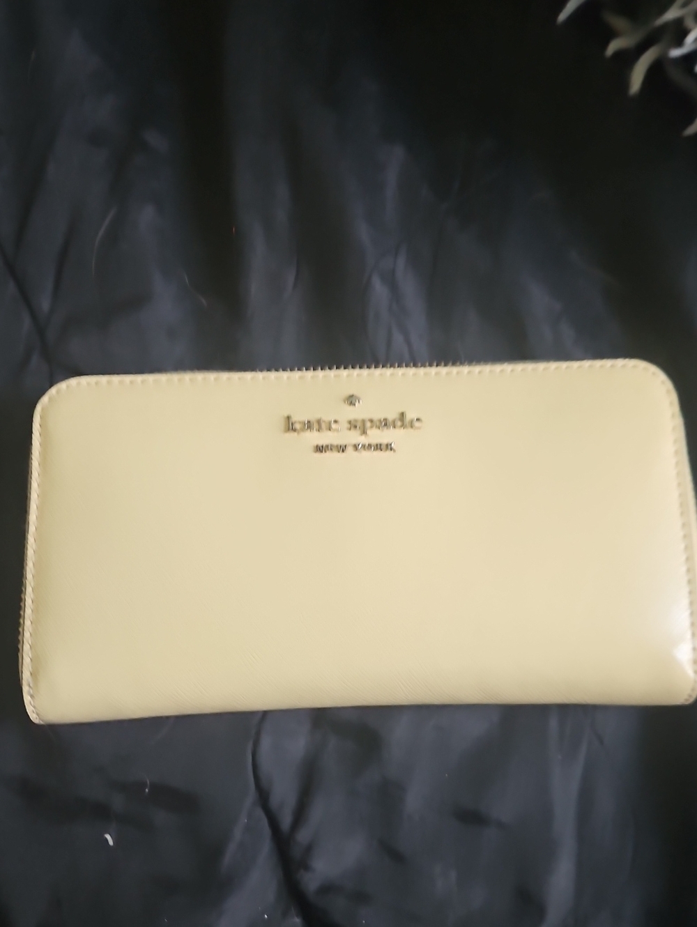 kate spade pale yellow zip-around wallet